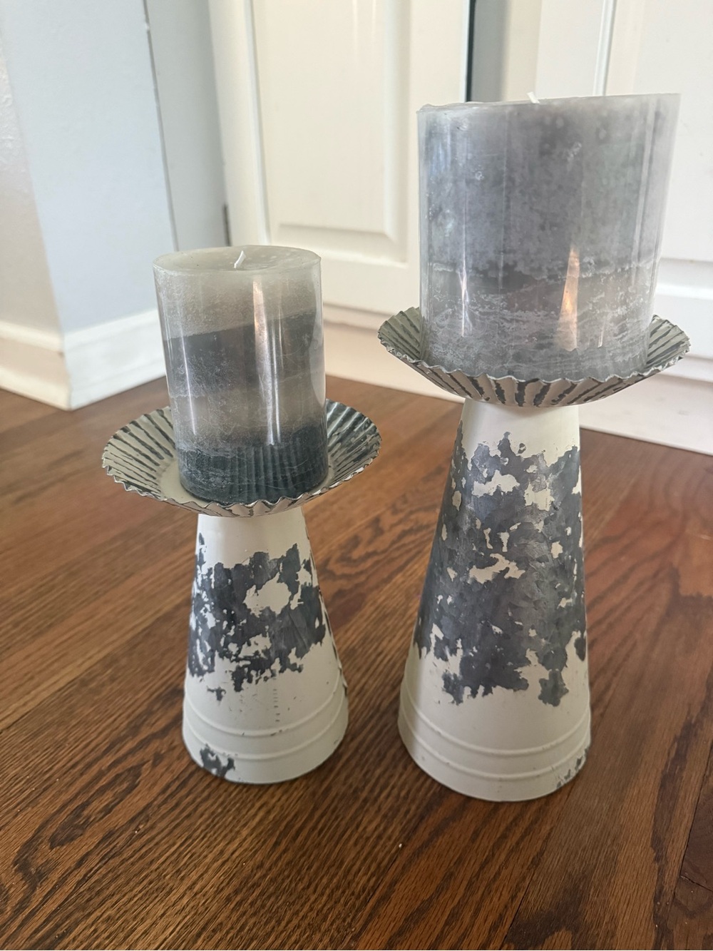 Pair of Distressed Metal Candle Holders with Gray Pillar Candles